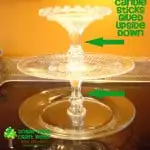 3 tier glass stand made with plates and candlesticks