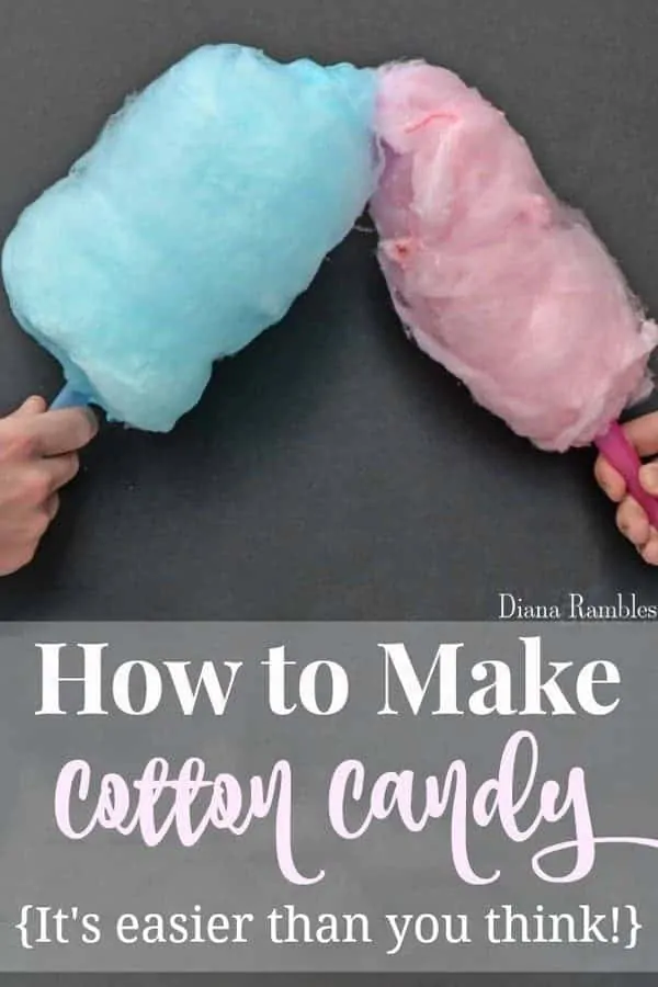 two hands holding blue and pink cotton candy
