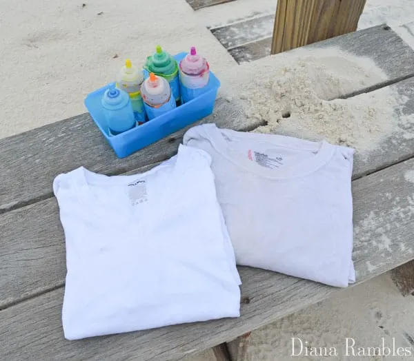 tie-dye shirts at the beach with sand supplies