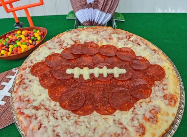 close up of a pizza with a football on it