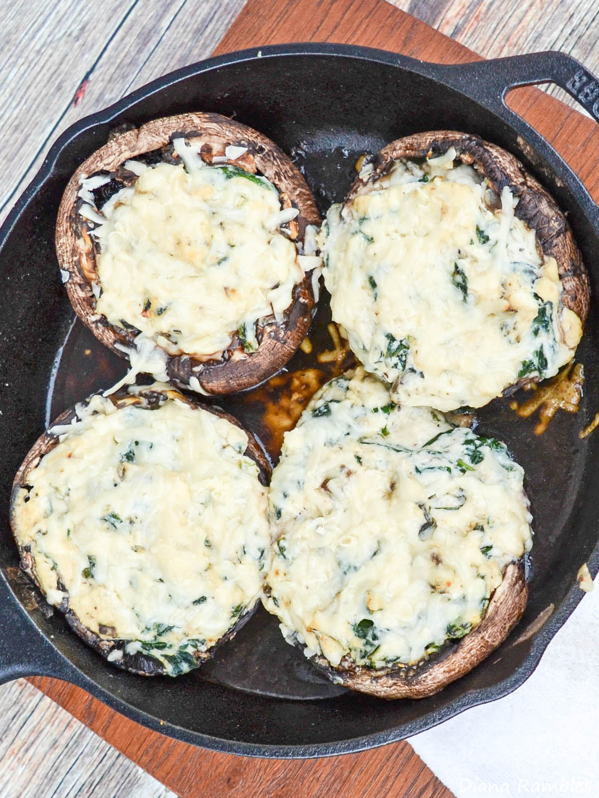 spinach and ricotta mushrooms baked in a cast-iron skillet