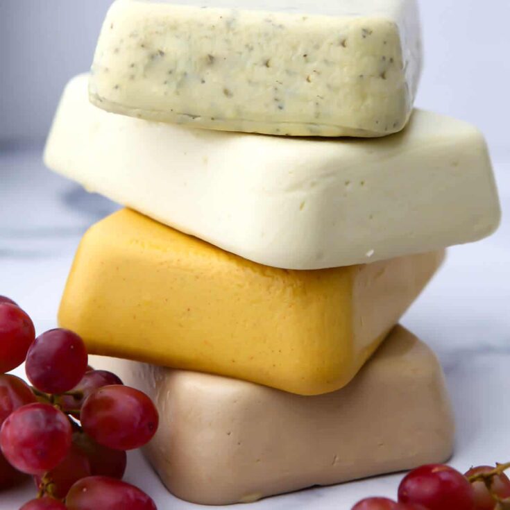 stack of vegan cheeses