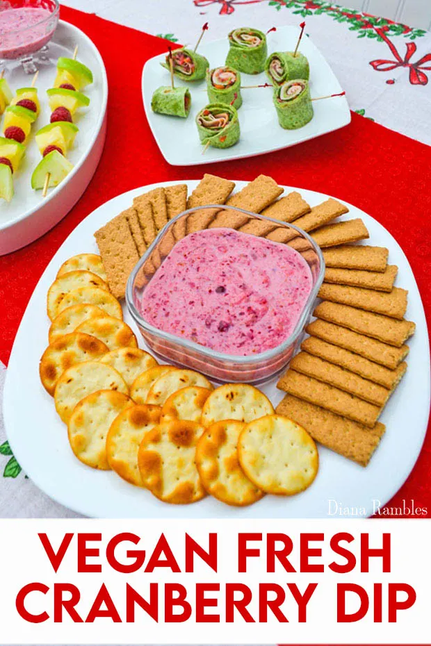 Vegan Fresh Cranberry Yogurt Dip with crackers, fruit, and pinwheels